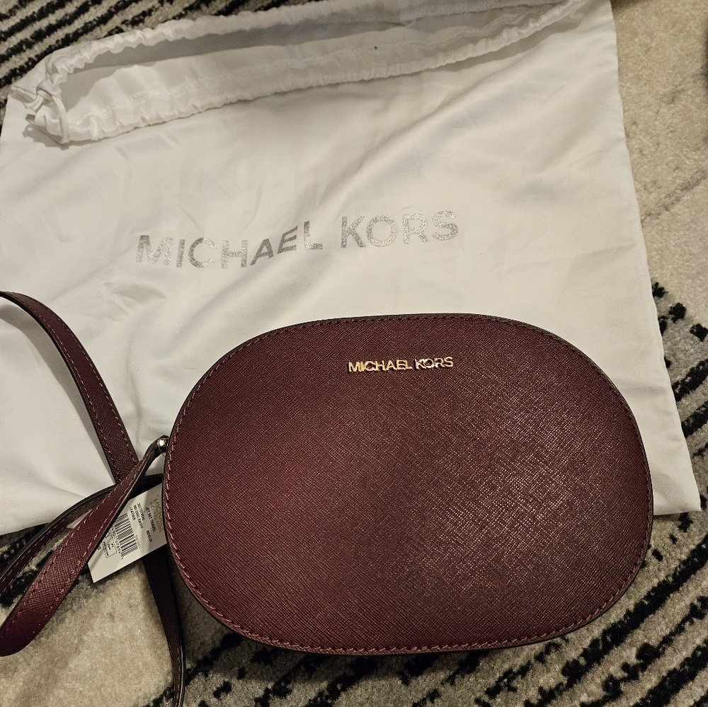 Authentic Brand new Michael Kors Jet set bag in merlot color